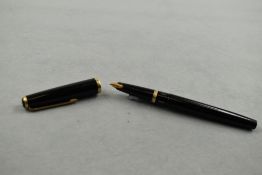 A Lamy 27 piston fill fountain pen in black having Lamy 14k nib. Approx 13.4cm