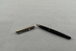 A Parker 61 fountain pen in black with steel cap. Approx 13.5cm