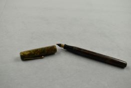 A Waterman 92 leverfill fountain pen in green and gold marble with single band to the cap having