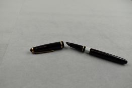 A De La Rue Onoto K2 piston fill fountain pen in black with single broad band to cap having shielded