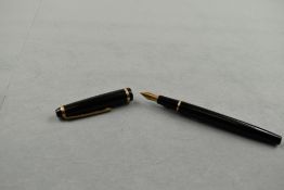 A De La Rue Onoto K3 cartridge fountain pen in black with single broad band to cap having De La