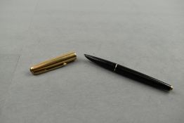 A Parker 61 fountain pen in black with gold cap. Approx 13.4cm