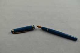 A De La Rue Onoto K3 cartridge fountain pen in green with single broad band to cap having De La