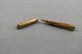 A Wahl leverfill fountain pen in gold with ring top cap having Wahl 2 nib. Engraved. Approx 9.5cm