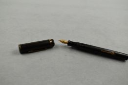 A Tudor Minor leverfill fountain pen in black having two narrow rings to the cap with a Progress