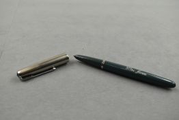 A Parker 51 fountain pen in dove grey with steel cap (Engraved). Approx 13.7cm