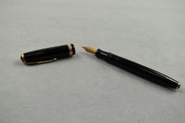 A Parker Duofold fountain pen in black with broad decorative band to cap having Parker Duofold N