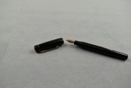 A Croxley leverfill fountain pen in black with narrow band to the cap having Dickinson nib. Approx