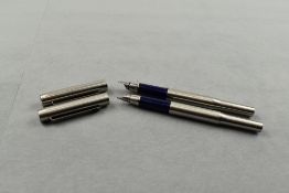 Two Parker 25 Flighter fountain pens in stainless steel