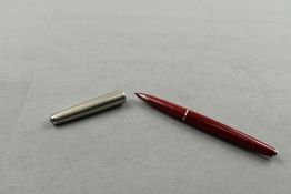 A Parker 61 fountain pen in red with steel cap. Approx 13.4cm