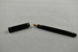 A Parker Duofold Junior in black chaised with two narrow bands to cap having Parker N nib. Approx