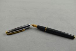 A Waterman Ligne 60 cartridge/ converter fountain pen in grey with silver cap with gold trim