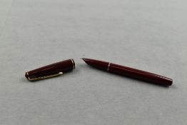 A Parker 17 lady fountain pen in burgundy with narrow band to the cap. Approx 11.7cm