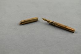 A Wahl leverfill fountain pen in gold with ring top cap having Wahl 0 nib. Approx 8.4cm