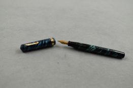 An Eversharp vacuum fill fountain pen (needs sac) in blue swirl with single band to the cap having