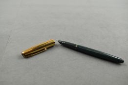A Parker 51 fountain pen in dove grey with gold cap. Approx 13.7cm