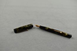 A De La Rue 1530/92 leverfill fountain pen in green and black marble with Onoto 14ct nib. Approx