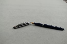 A Waterman Ideal cartridge/converter fountain pen in blue having steel cap with Waterman 14ct nib.