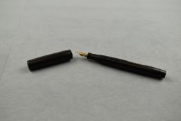 A Mabie Todd Blackbird BB2 60 clipless leverfill fountain pen in hard rubber with circular
