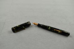 A Mentmore Auto Flow leverfill fountain pen in green/black marble with single band to cap having