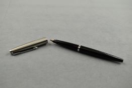 A Parker 45 Classic fountain pen in black with steel cap. Approx 13.8cm