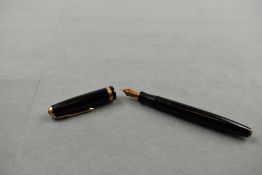 A Parker Duofold fountain pen in black with broad decorative band to cap having Parker Duofold N
