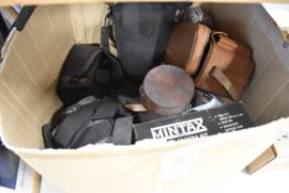 A selection of mixed items and cameras with accessories
