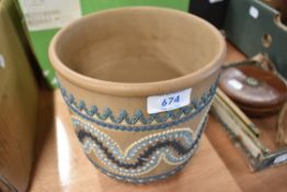 A Doulton Lambeth Silicon ware jardiniere having raised swag and fan decoration, height approx.