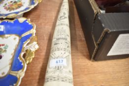 A modern scrimshaw replica marine tusk
