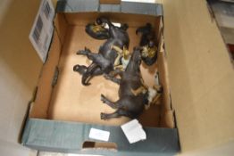A group of four 20th century Chinese pottery figures, Children on oxen in various poses.