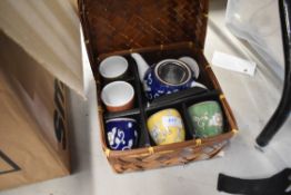 A Chinese styled picnic tea set with harlequin pattern design