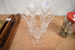 A set of five 20th century wine or ale glasses having baluster stem on fluted and cut bowls
