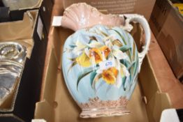 A late 19th or early 20th Century wash jug having gilt heightened daffodil decoration