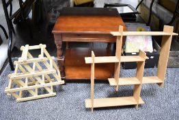 A modern side table with wall shelf and wine rack