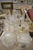 A selection of clear cut crystal glass wares including spirit glasses, decanters and serving dishes