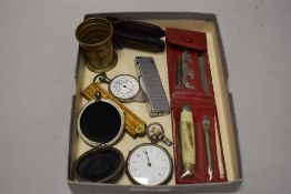 A selection of curios including pocket knife, travel cup, cigarette lighter and pocket watch