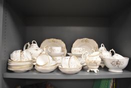 A Victorian part tea service having white ground with gilt floral pattern