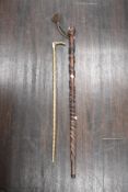 An early 20th century bamboo and horn handle riding crop with mahogany walking cane or stick