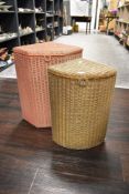 Two 1950's Lloyd loom laundry or wash baskets one pink and one gold effect