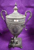 A large Victorian pewter tea urn or samovar, with chase decoration and serpent form handles