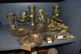 A selection of brass and metal wares including blacksmith figure, temple bowls and hour glass
