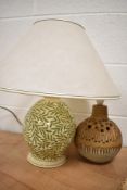 A mid century studio pottery lamp base and similar hand painted wooden lamp