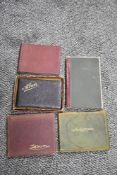 A selection of early 20th century autograph albums including poems signatures and illustrations