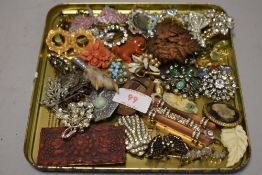A selection of Edwardian and later costume jewellery brooches and pin badges