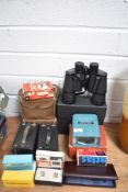 A selection of cameras and optical devices including Super Zenith 10x50 binoculars etc