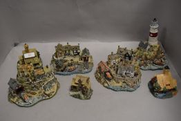 A selection of modern Danbury mint miniature model RNLI life boat houses