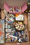 A selection of haberdashery and sewing items including buttons and knitting needles