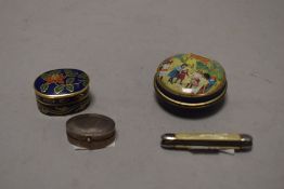 A white metal pill container with a miniature mother of pearl handle pocket knife etc