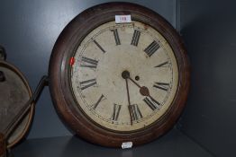 An early 20th century station style fusee wall clock missing glass and untested