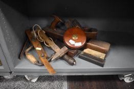 A selection of woodworking or joiners tools including large draw knife
